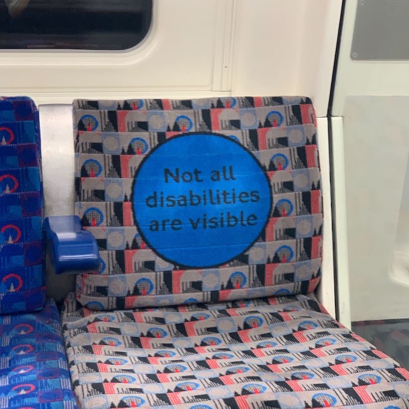 A London Underground seat with the words: not all disabilities are visible