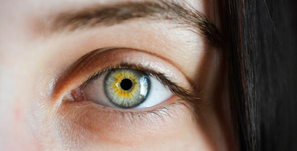 Close-up shot of a woman's green eye