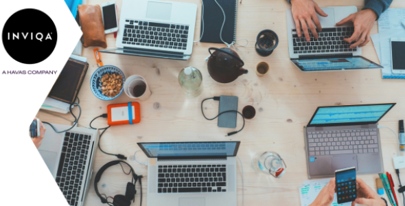 Image of a group of people using computers and phones | Inviqa blog