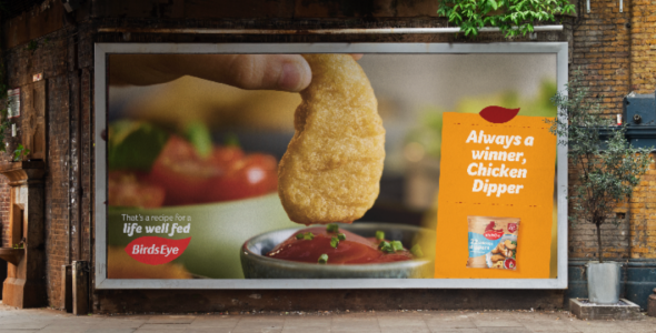 A billboard showing a BirdsEye Chicken Dipper being dipped into tomato sauce