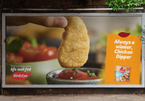 A billboard showing a BirdsEye Chicken Dipper being dipped into tomato sauce