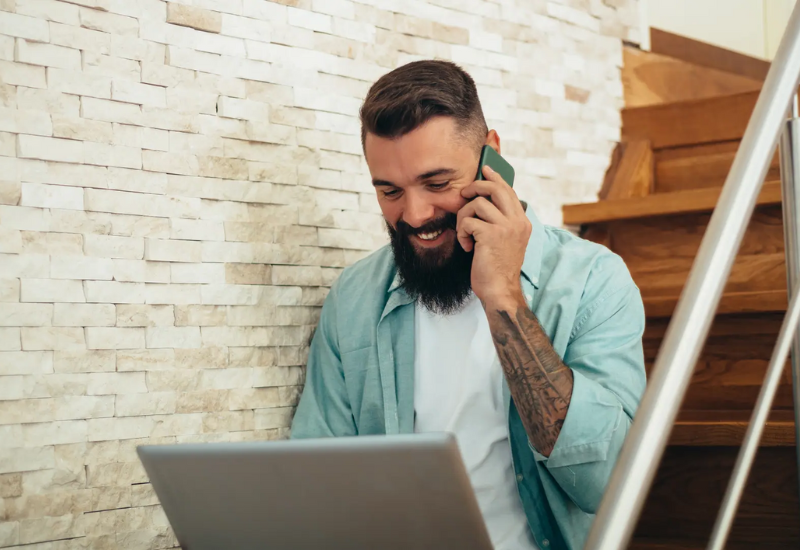 Man using phone while browsing the internet
