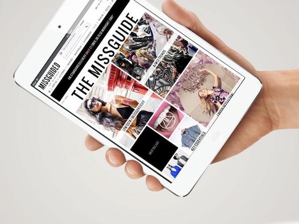 Missguided site on tablet being held in one hand