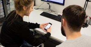 Female and male user testing on mobile