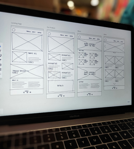 Laptop showing website wireframe