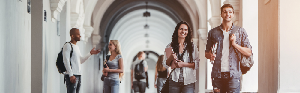 Students walking down a university coridor